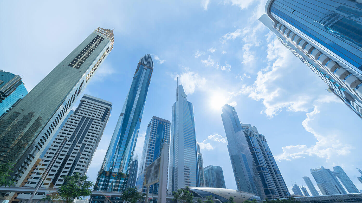 Modern Dubai skyline with skyscrapers symbolizing relocation, taxes, and international business activities
